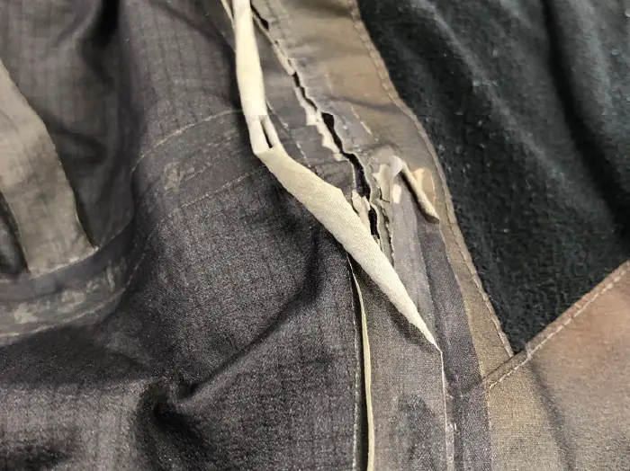 A condition where the seam tape of the garment has come off