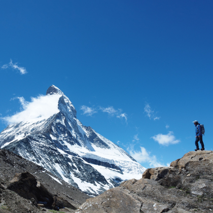 Isamu Tatsuno looking up at the summit from the foot of the Eiger North Face.
