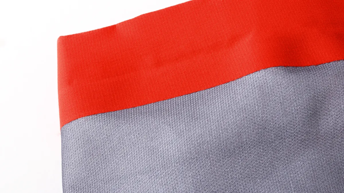 Sleeve cuffs finished with adhesive bonding