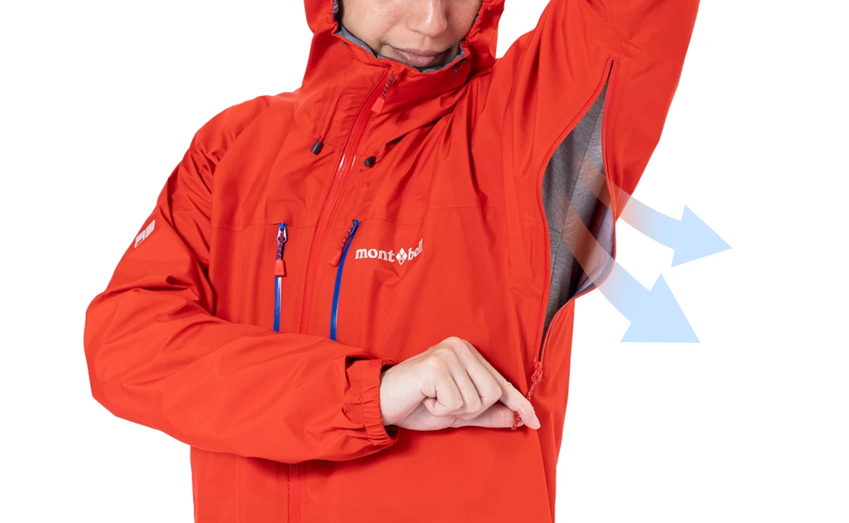 An image of a man wearing the jacket, opening the pit zip.  The explanation follows later.