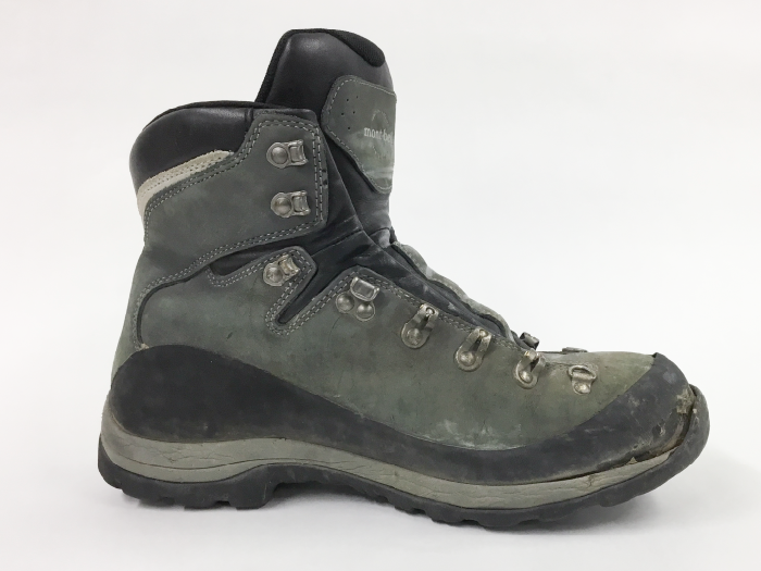 Hiking boot outsole before repair: Toe sole detached due to aging.