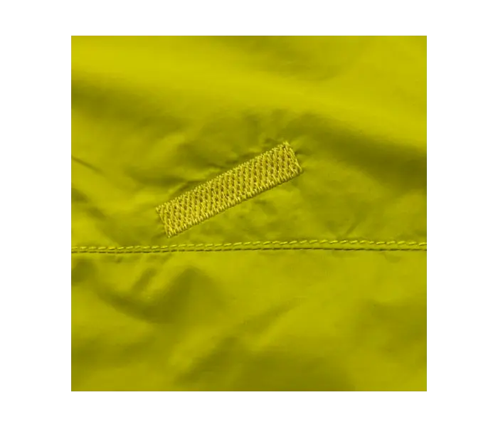 Windshell after repair: Holes mended using specialized sewing machine.