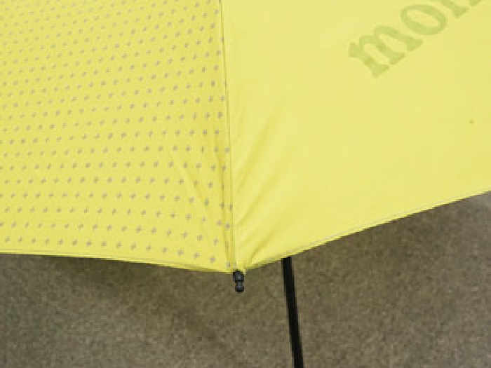Yellow umbrella after repair: Rib replaced.