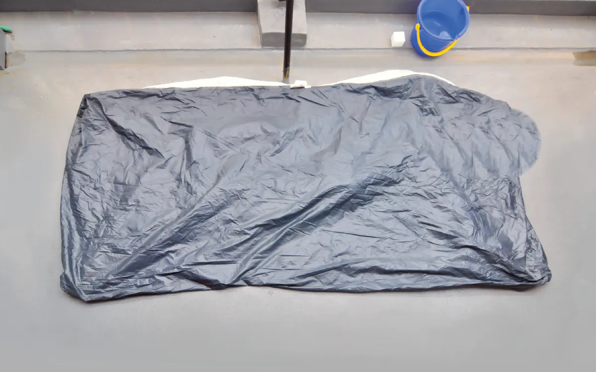 The tent is spread out on the ground with its base facing upwards.