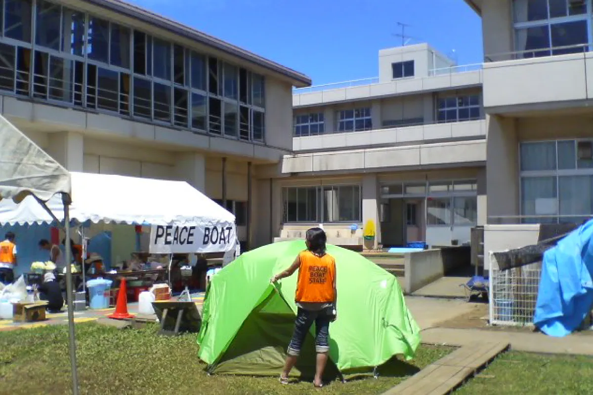 NGO Peace Boat providing support to disaster victims at an evacuation center.
