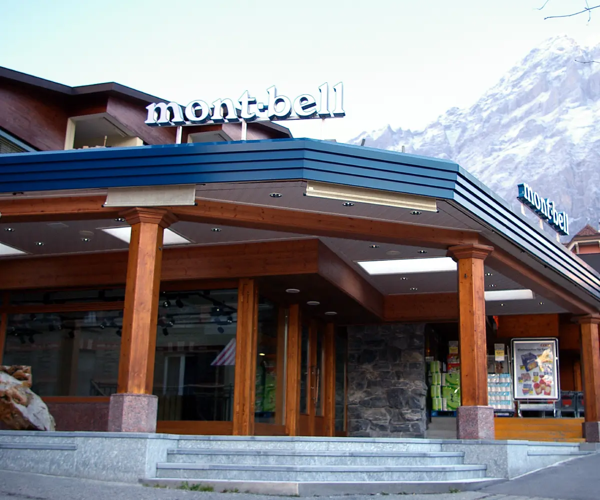 Exterior view of the Montbell Grindelwald store. The famous Eiger mountain looms closely behind the store.