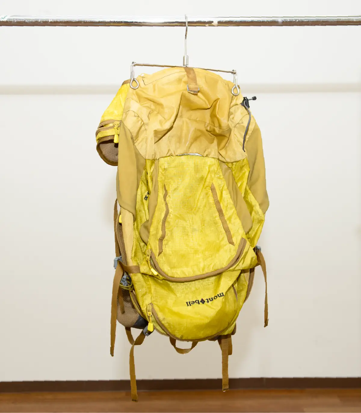 Photo of backpack hanging upside down to dry.