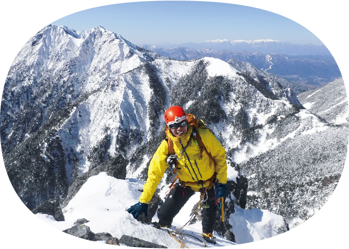An image of climbing a steep, snow-covered mountain.