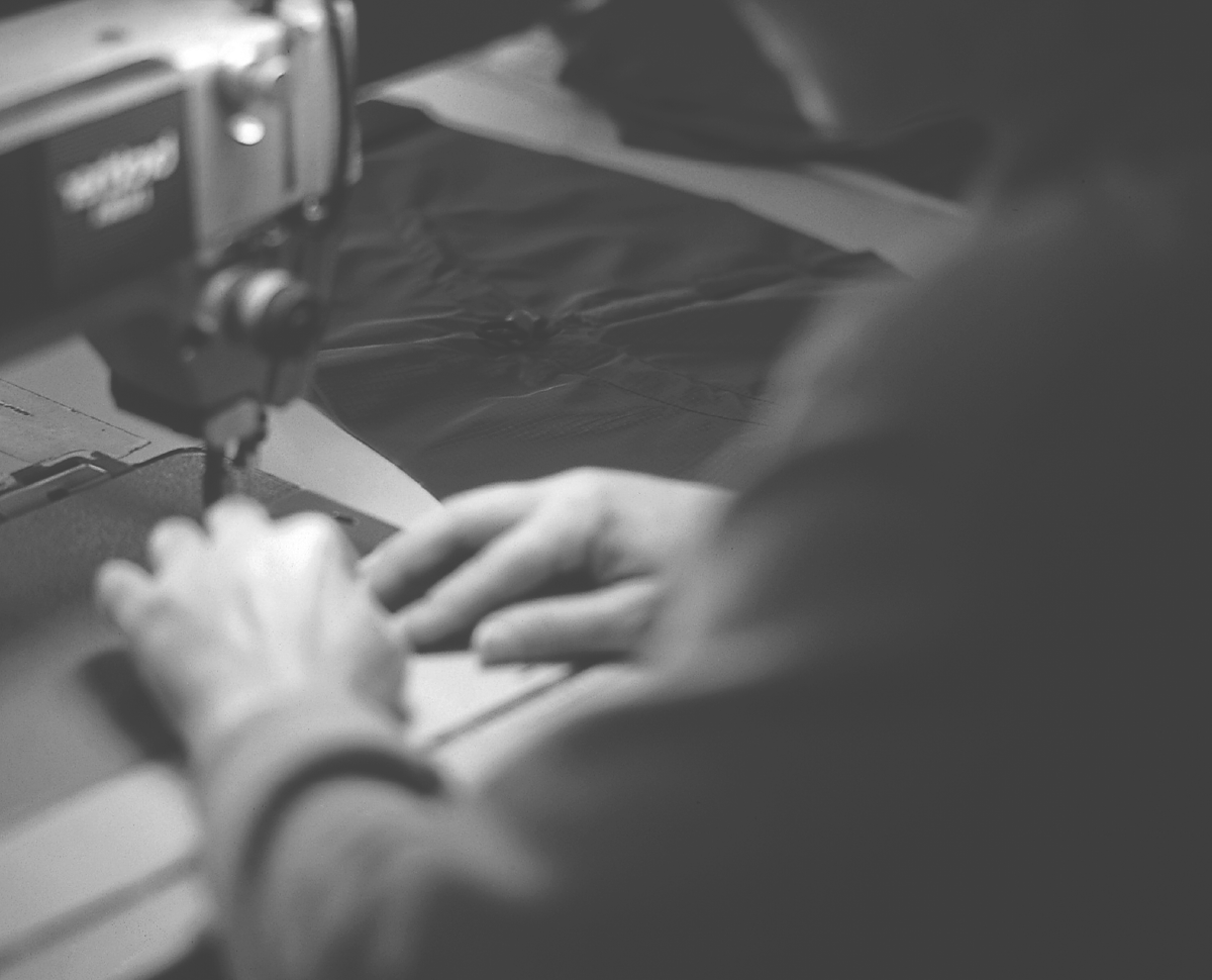 Hands working on a sewing machine