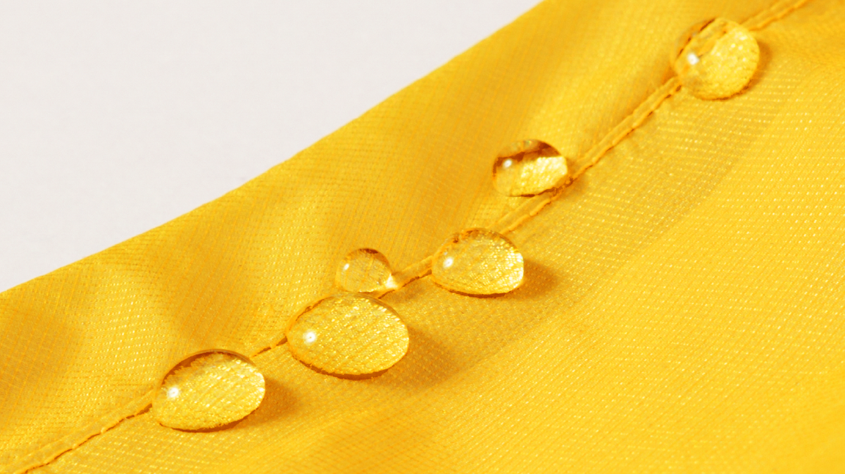 Image of water droplets rolling off the fabric surface