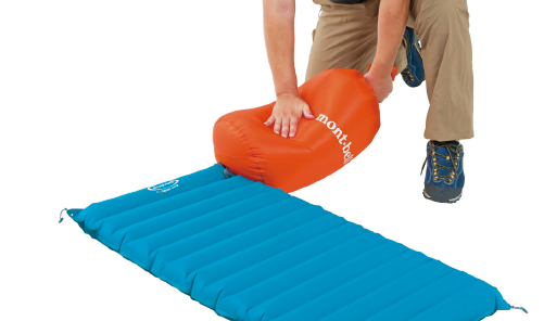 Image of inflating the pad using a pump stuff bag